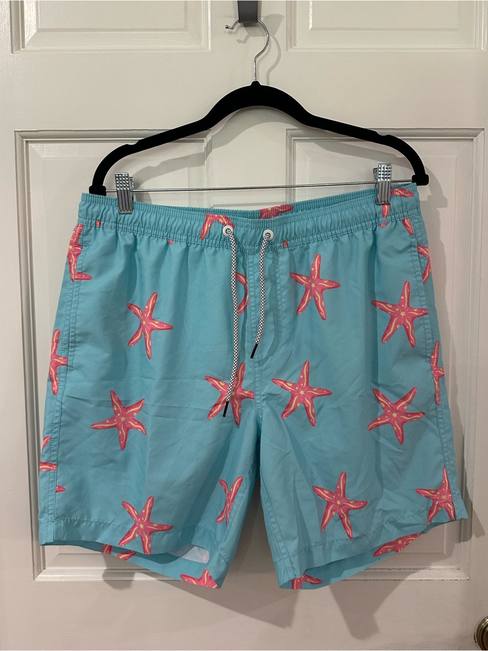 Maamgic. Turquoise Swim Trunks with Pink Starfish Print